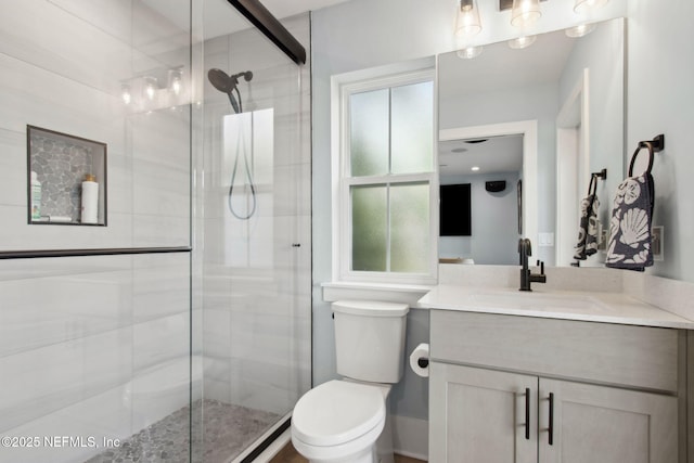 548 Sea Island Dr, Fernandina Beach, FL 32034 - bathroom with toilet, a stall shower, and vanity