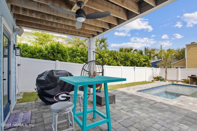 548 Sea Island Dr, Fernandina Beach, FL 32034 - view of patio with a fenced backyard, grilling area, a ceiling fan, and a jacuzzi