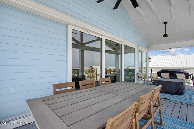 548 Sea Island Dr, Fernandina Beach, FL 32034 - wooden terrace with outdoor dining space and a ceiling fan