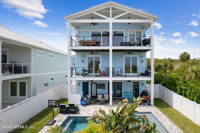 548 Sea Island Dr, Fernandina Beach, FL 32034 - back of house featuring a balcony, a ceiling fan, an outdoor hangout area, and a patio