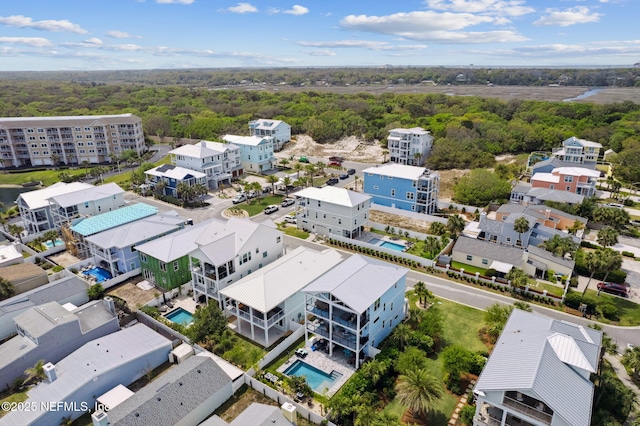 548 Sea Island Dr, Fernandina Beach, FL 32034 - bird's eye view of a pool area and a heavily wooded area