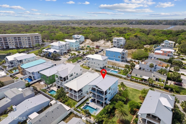 548 Sea Island Dr, Fernandina Beach, FL 32034 - aerial view of a pool and a heavily wooded area