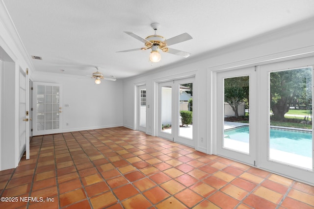 1228 Old Mill Rd, Orlando, FL 32806 - interior space featuring visible vents, a ceiling fan, tile patterned flooring, and a healthy amount of sunlight