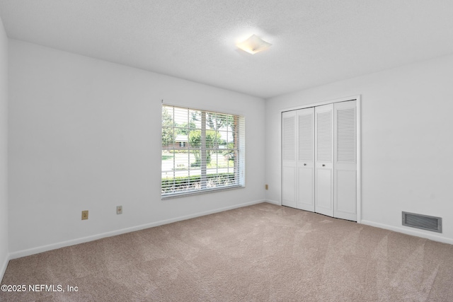 1228 Old Mill Rd, Orlando, FL 32806 - unfurnished bedroom featuring carpet floors, baseboards, a closet, and visible vents
