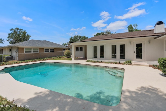 1228 Old Mill Rd, Orlando, FL 32806 - view of swimming pool with fence, a fenced in pool, and a patio