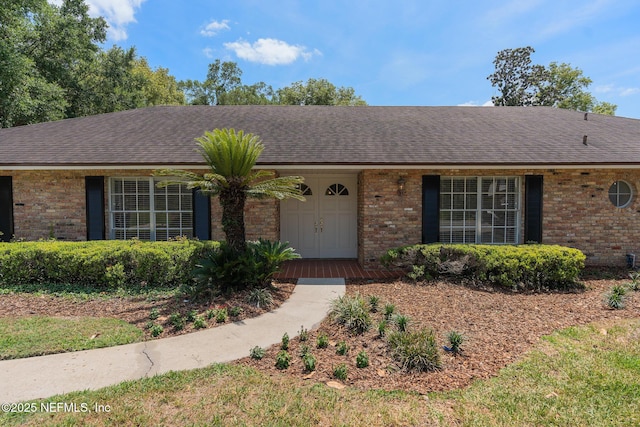 1228 Old Mill Rd, Orlando, FL 32806 - ranch-style house featuring brick siding and a shingled roof
