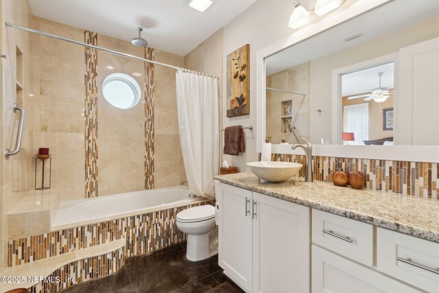 111 Cherry St, Neptune Beach, FL 32266 - full bath with vanity, ceiling fan, toilet, a combined bath / shower with rainfall shower, and tile patterned flooring