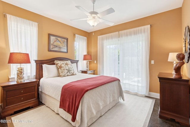 111 Cherry St, Neptune Beach, FL 32266 - bedroom with baseboards, ceiling fan, and access to exterior