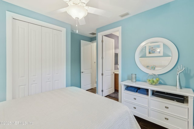 111 Cherry St, Neptune Beach, FL 32266 - bedroom with a ceiling fan, a closet, connected bathroom, dark wood finished floors, and visible vents