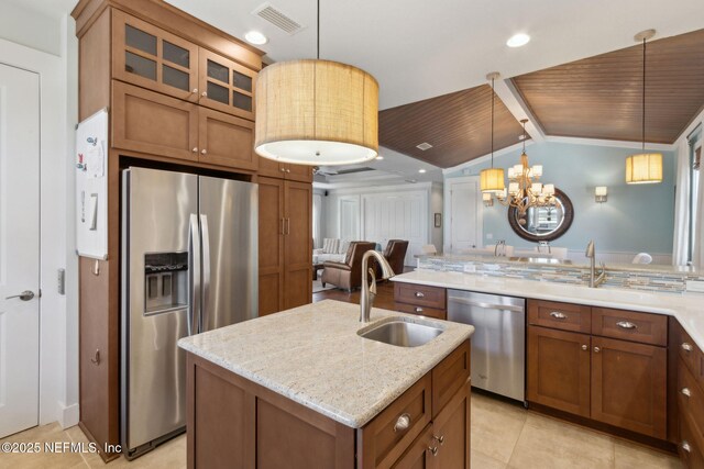 111 Cherry St, Neptune Beach, FL 32266 - kitchen featuring brown cabinets, stainless steel appliances, and a sink