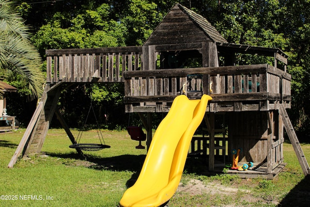 view of jungle gym with a lawn