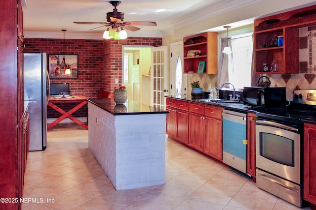 kitchen with stainless steel appliances, a sink, dark countertops, open shelves, and ornamental molding