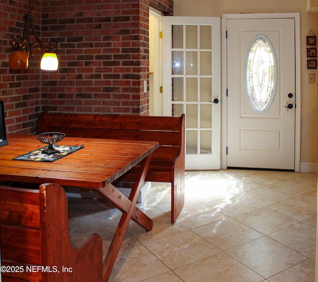 dining space with light tile patterned floors