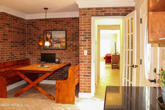 dining room featuring french doors, light tile patterned floors, and crown molding