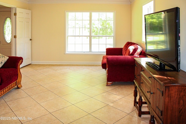 living room with baseboards, light tile patterned floors, and crown molding