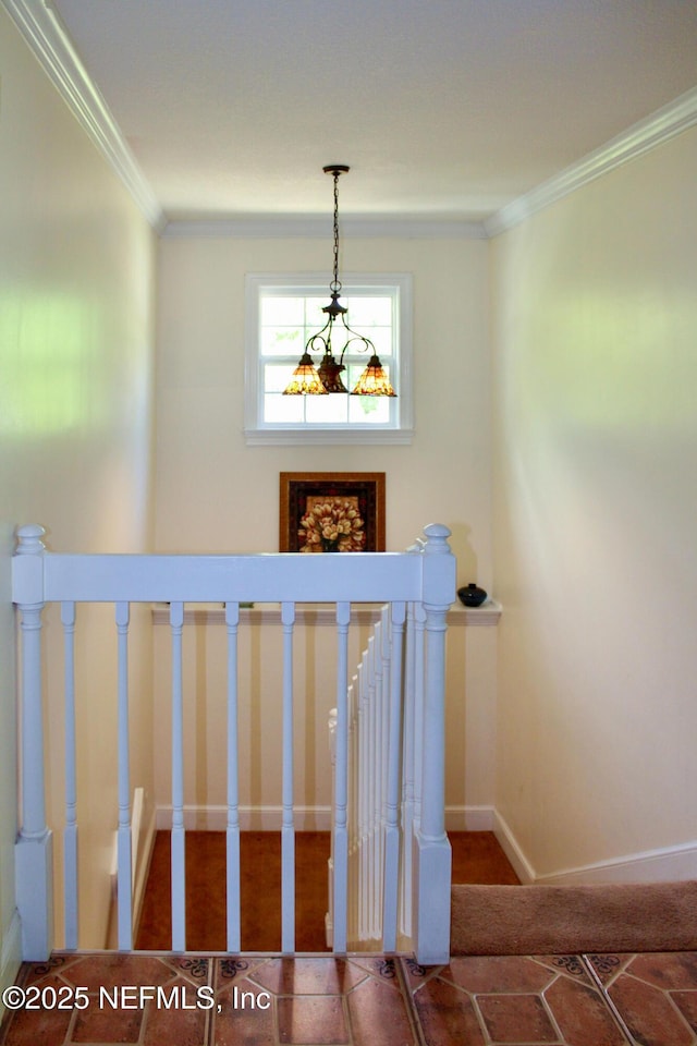 staircase with baseboards and crown molding