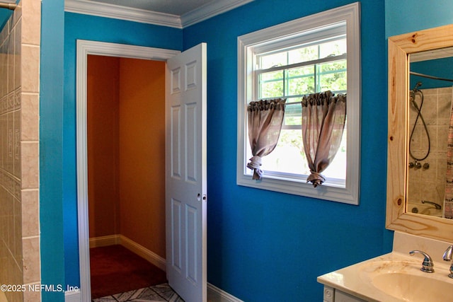 bathroom with walk in shower, vanity, and ornamental molding