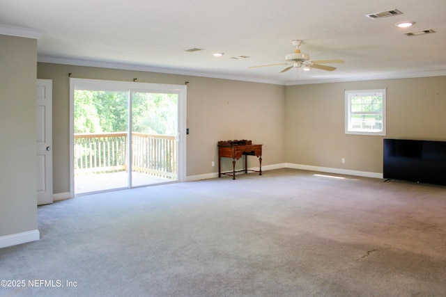 unfurnished living room with ceiling fan, crown molding, and visible vents