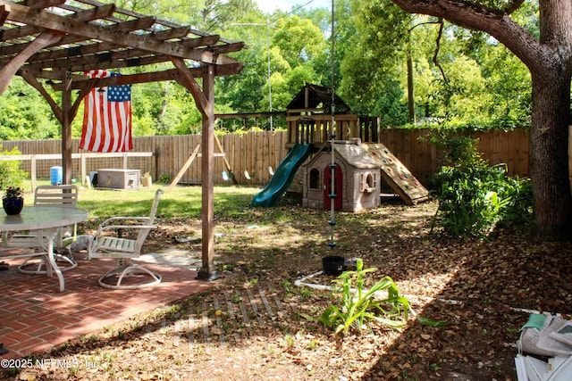 view of jungle gym featuring a fenced backyard, a pergola, and a patio area