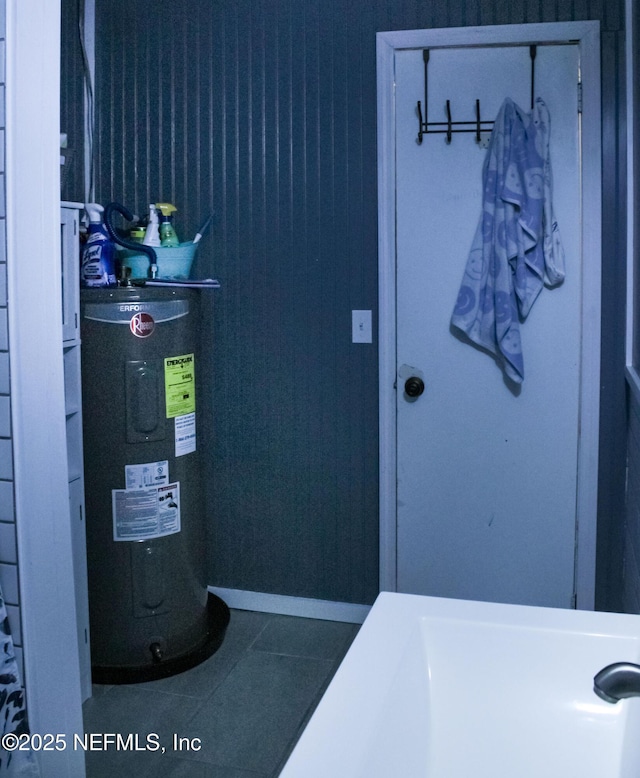 utility room featuring electric water heater