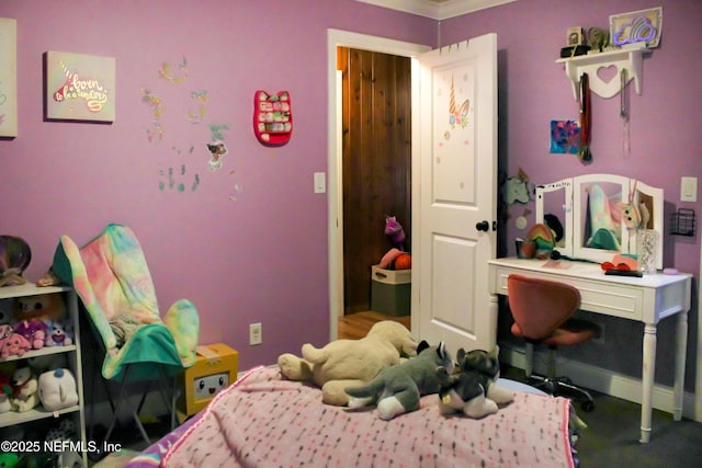 bedroom featuring baseboards and crown molding