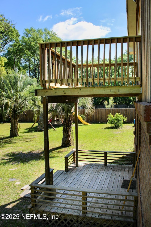 exterior space featuring a fenced backyard, a playground, and a lawn