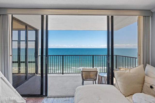 1301 1st St S Unit 1507, Jacksonville Beach, FL 32250 - carpeted bedroom featuring floor to ceiling windows and a water view