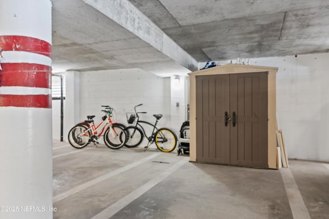 1301 1st St S Unit 1507, Jacksonville Beach, FL 32250 - parking garage featuring concrete block wall and a shed