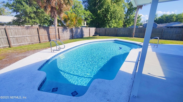 view of pool with a yard, a fenced backyard, and a patio area