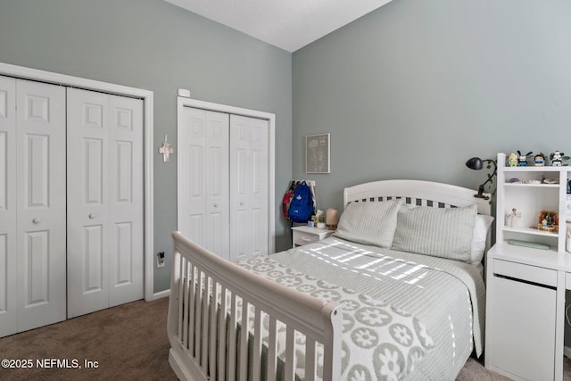 carpeted bedroom with two closets