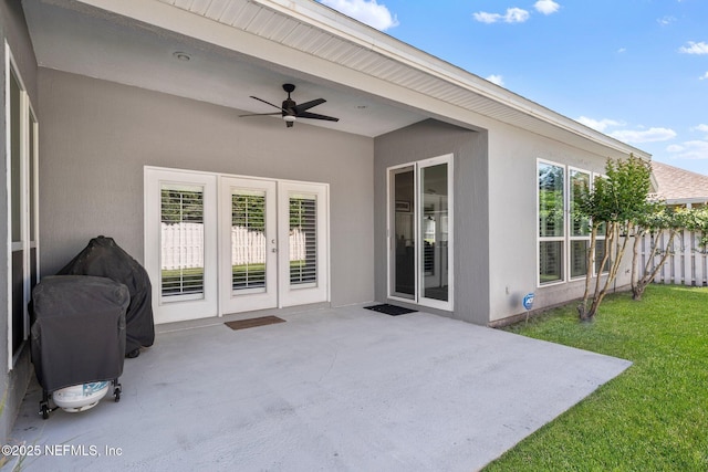 view of patio featuring ceiling fan
