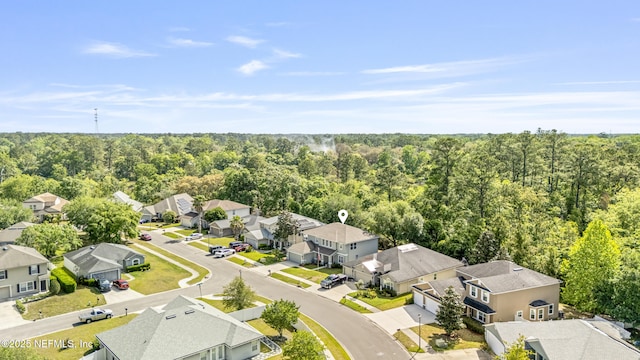 bird's eye view featuring a view of trees and a residential view