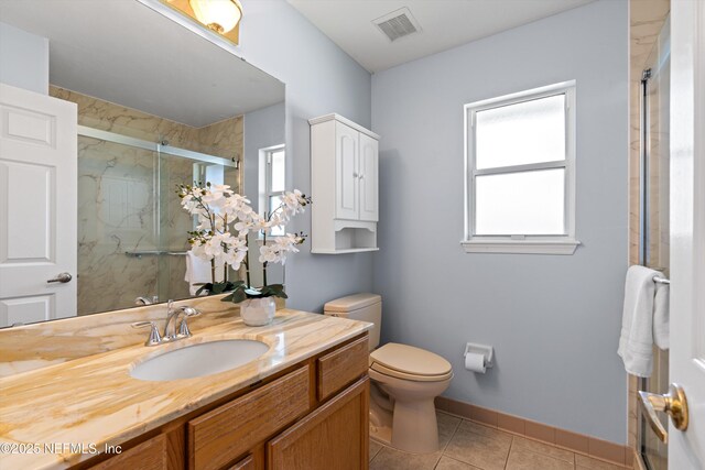 full bath featuring visible vents, vanity, toilet, tile patterned floors, and a marble finish shower