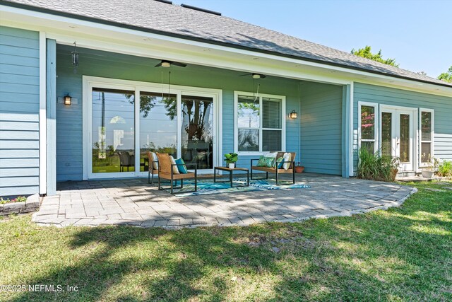 back of house featuring a lawn, a ceiling fan, a patio, and french doors