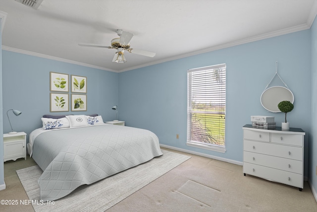 carpeted bedroom featuring crown molding, baseboards, ceiling fan, and visible vents