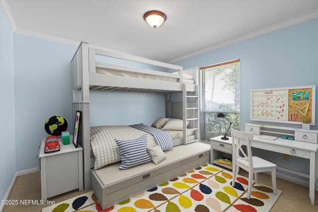 carpeted bedroom with baseboards and ornamental molding