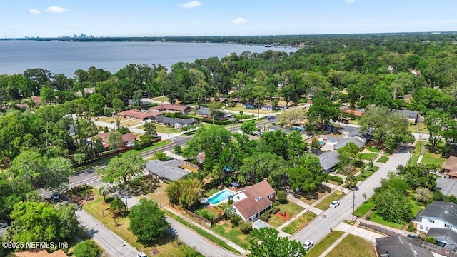 drone / aerial view featuring a water view and a residential view