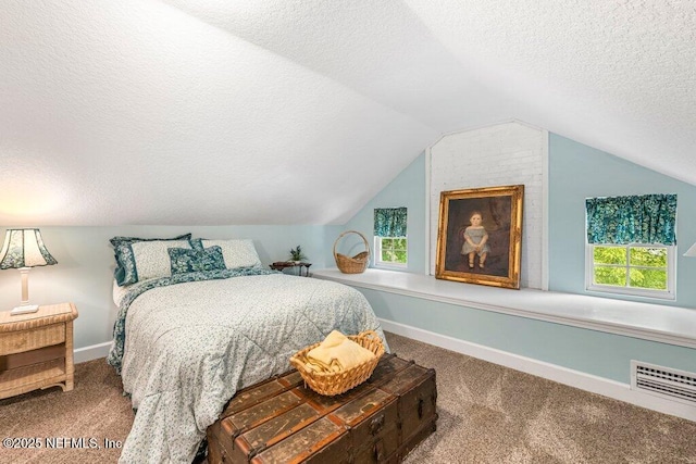 carpeted bedroom featuring a textured ceiling, visible vents, baseboards, and lofted ceiling