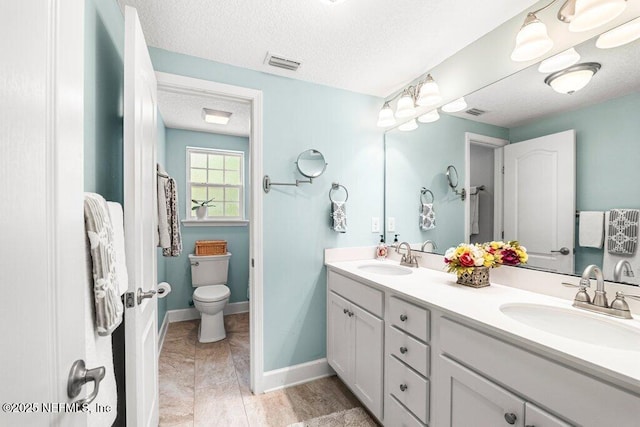 full bathroom featuring visible vents, a sink, a textured ceiling, and double vanity