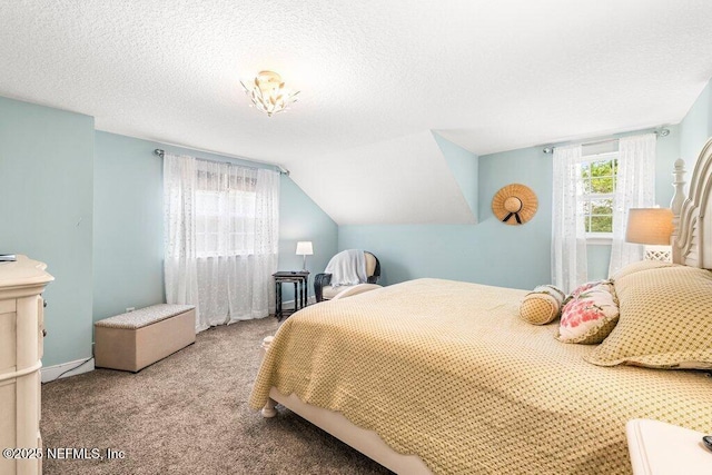 bedroom featuring carpet, a textured ceiling, and lofted ceiling