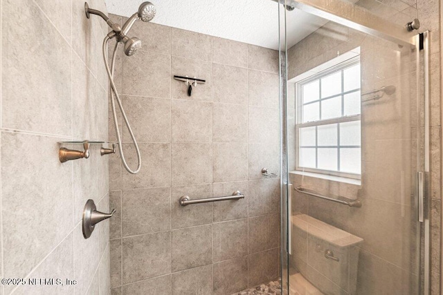 full bath with a shower stall