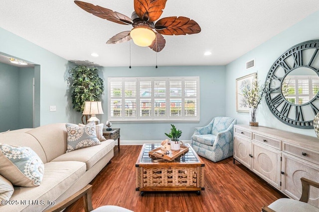 living room featuring visible vents, recessed lighting, dark wood finished floors, and ceiling fan