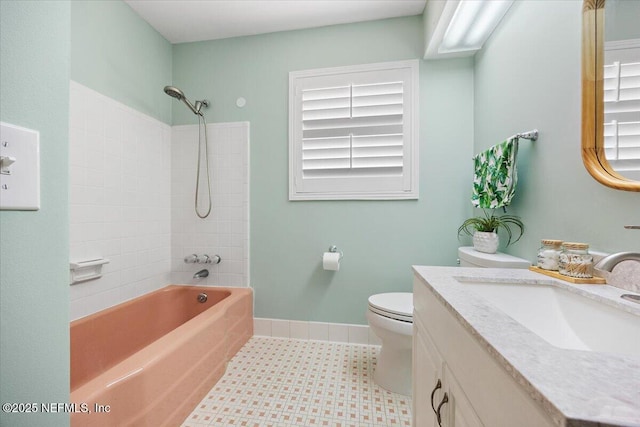 full bathroom with vanity, bathtub / shower combination, toilet, tile patterned floors, and baseboards