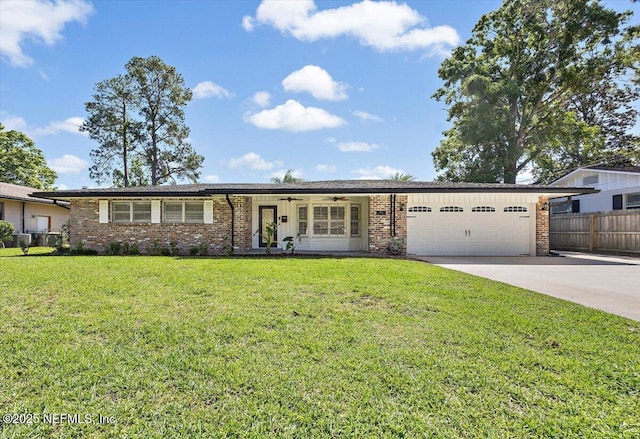 ranch-style house with concrete driveway, brick siding, an attached garage, and fence
