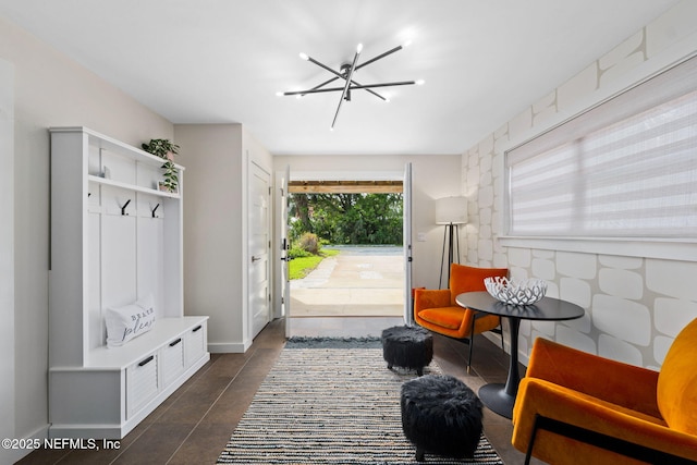 2740 Loja St, Saint Augustine, FL 32084 - mudroom featuring a notable chandelier and baseboards