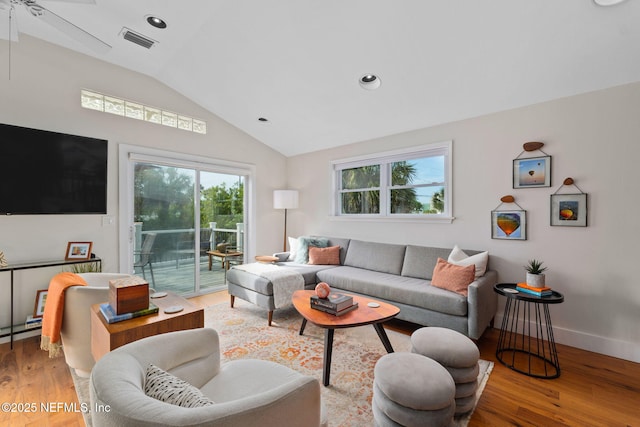 2740 Loja St, Saint Augustine, FL 32084 - living area with light wood finished floors, visible vents, vaulted ceiling, and a healthy amount of sunlight