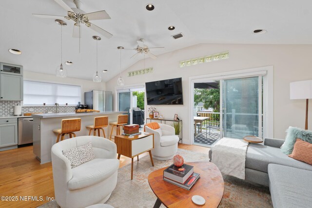 2740 Loja St, Saint Augustine, FL 32084 - living room featuring a healthy amount of sunlight, visible vents, ceiling fan, and lofted ceiling