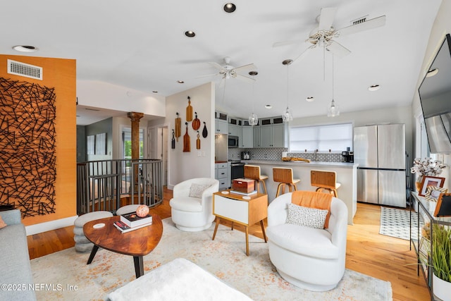 2740 Loja St, Saint Augustine, FL 32084 - living area with ornate columns, visible vents, ceiling fan, and light wood-style flooring