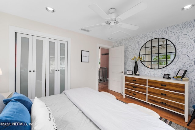 2740 Loja St, Saint Augustine, FL 32084 - bedroom with visible vents, wallpapered walls, attic access, recessed lighting, and wood finished floors