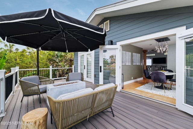 2740 Loja St, Saint Augustine, FL 32084 - wooden deck with an outdoor living space with a fire pit